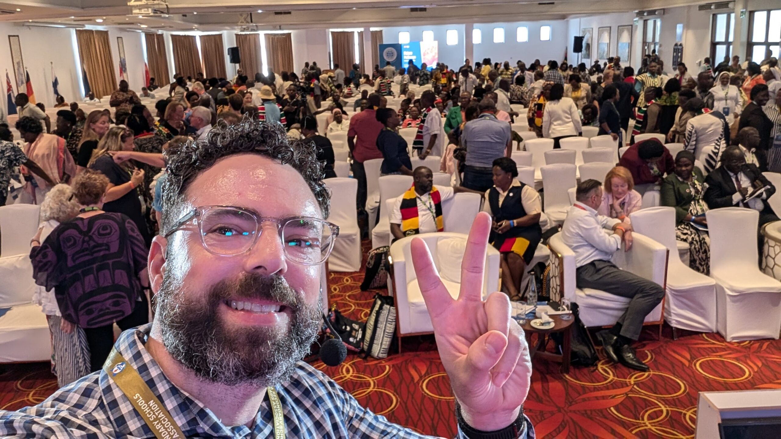 Danny Bauer speaking on stage to 1,000 school leaders in Mombasa, Kenya.